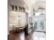 Elegant dining area featuring a large table, chandelier, and bright natural light at 8704 Ingleton Ct, Orlando, FL 32836