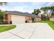 Charming single-Gathering home with a spacious driveway and well-manicured front yard at 8704 Ingleton Ct, Orlando, FL 32836