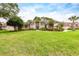 Beautiful single-story home with a sprawling green lawn and mature landscaping at 8704 Ingleton Ct, Orlando, FL 32836