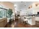 Open concept kitchen with marble countertops, stainless steel appliances, and hardwood floors at 8704 Ingleton Ct, Orlando, FL 32836