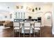 Spacious kitchen with a large island, white cabinets, and hardwood floors at 8704 Ingleton Ct, Orlando, FL 32836