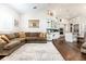 Open floor plan with living room flowing into a bright eat-in kitchen space with hardwood flooring at 8704 Ingleton Ct, Orlando, FL 32836