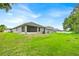 Expansive backyard with lush green lawn, offering ample space for outdoor activities and recreation at 907 Pearly Ridge Ln, Lakeland, FL 33809