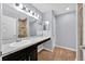 Bright bathroom with marble countertops, sleek vanity, updated lighting, and a tiled shower stall at 907 Pearly Ridge Ln, Lakeland, FL 33809