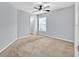 Spacious bedroom features neutral paint, a ceiling fan, and soft carpeting at 907 Pearly Ridge Ln, Lakeland, FL 33809