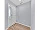Inviting foyer featuring vinyl plank flooring and a sleek white front door at 907 Pearly Ridge Ln, Lakeland, FL 33809