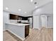 Open-concept kitchen featuring stainless steel appliances, a breakfast bar, and ample counter space at 907 Pearly Ridge Ln, Lakeland, FL 33809