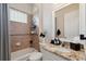 Cozy bathroom with a shower over tub and granite counter on the vanity at 9426 Burnam Dr, Weeki Wachee, FL 34613