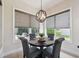 Charming breakfast nook bathed in light, with a modern fixture and comfortable seating at 9426 Burnam Dr, Weeki Wachee, FL 34613