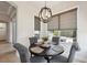 Bright breakfast nook features a dark table set and natural light from surrounding windows at 9426 Burnam Dr, Weeki Wachee, FL 34613