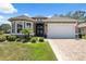 Charming single-story home with manicured landscaping, neutral paint, and an inviting double-door entrance at 9426 Burnam Dr, Weeki Wachee, FL 34613