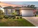 Charming single-story home with manicured landscaping, neutral paint, and an inviting double-door entrance at 9426 Burnam Dr, Weeki Wachee, FL 34613