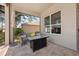 Relaxing outdoor patio area with comfortable seating and a view of the landscaped yard at 9426 Burnam Dr, Weeki Wachee, FL 34613