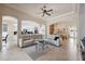 Open-concept living room with tile floors, neutral tones, and plenty of natural light at 9426 Burnam Dr, Weeki Wachee, FL 34613