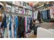 A large walk-in closet with storage solutions, shelving, and clothing racks at 9426 Burnam Dr, Weeki Wachee, FL 34613