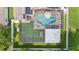 Aerial view of a backyard featuring a pool, putting green, and patio at 9774 Bohart Ct, Orlando, FL 32836