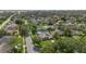 Aerial view of a neighborhood featuring a home with solar panels and a screened pool at 9774 Bohart Ct, Orlando, FL 32836