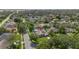 Aerial view of a neighborhood featuring a home with solar panels and a screened pool at 9774 Bohart Ct, Orlando, FL 32836