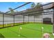 Backyard putting green with flag poles in a covered area at 9774 Bohart Ct, Orlando, FL 32836