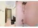 Bright bathroom with light pink tile and modern shower head at 9774 Bohart Ct, Orlando, FL 32836