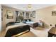 Neutral bedroom with two beds, natural light, and UFO themed art at 9774 Bohart Ct, Orlando, FL 32836
