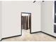 Bedroom with neutral walls, tile flooring, and a view to another room through a doorway at 9774 Bohart Ct, Orlando, FL 32836