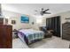 Cozy bedroom with ceiling fan, wall art, and comfortable furnishings at 9774 Bohart Ct, Orlando, FL 32836