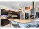 Modern kitchen featuring stainless steel appliances, granite countertops, and barstool seating at 9774 Bohart Ct, Orlando, FL 32836