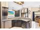 Stylish kitchen with granite counters, stainless appliances, and an open layout for entertaining at 9774 Bohart Ct, Orlando, FL 32836