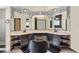 The main bathroom has dual sinks, vanity area, and decorative mirrors and lighting at 9774 Bohart Ct, Orlando, FL 32836