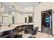 The main bathroom has dual sinks, vanity area, decorative mirrors and lights, and a walk-in closet at 9774 Bohart Ct, Orlando, FL 32836