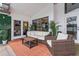 Inviting outdoor patio featuring comfortable seating and lush tropical plants at 9774 Bohart Ct, Orlando, FL 32836