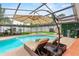 Pool area with outdoor seating, spa, sauna, and shade, great for relaxation and entertaining at 9774 Bohart Ct, Orlando, FL 32836