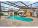 Tranquil pool area with a hot tub, sauna, lounge chairs, and covered enclosure at 9774 Bohart Ct, Orlando, FL 32836