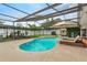 Enclosed pool area with dining, lounging, and a sauna; ideal for relaxation and entertainment at 9774 Bohart Ct, Orlando, FL 32836
