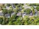 Aerial view showcasing the home's backyard, landscaping, and proximity to mature trees at 1008 Jackson Creek Ct, Oviedo, FL 32765