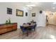 Dining area with hardwood floors, an oval dining table, and ample wall decor at 1008 Jackson Creek Ct, Oviedo, FL 32765