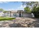 Inviting front exterior with blue door, manicured lawn, and charming details that create excellent curb appeal at 1008 Jackson Creek Ct, Oviedo, FL 32765