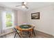 Bright game room featuring a ceiling fan and a poker table with window view at 1008 Jackson Creek Ct, Oviedo, FL 32765