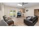 Comfortable living room with sliding doors leading to the backyard, creating a seamless indoor-outdoor living experience at 1008 Jackson Creek Ct, Oviedo, FL 32765