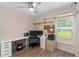 Well-lit office space featuring a large desk, printer, and bright window views at 1008 Jackson Creek Ct, Oviedo, FL 32765