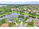 Beautiful aerial view of houses with ponds, trees, and landscaping in a residential neighborhood at 10836 Tilston Pt, Orlando, FL 32832
