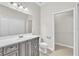 Bathroom with a vanity, and a walk in closet featuring shelving at 10836 Tilston Pt, Orlando, FL 32832