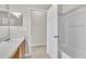 Bathroom featuring a shower and tub combination with tile floors and a wooden vanity at 10836 Tilston Pt, Orlando, FL 32832