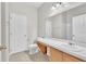 Bright bathroom featuring white vanity, ample countertop space, and tiled floors at 10836 Tilston Pt, Orlando, FL 32832