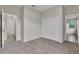 Bedroom featuring neutral walls, plush carpeting, and a closet with bi-fold doors at 10836 Tilston Pt, Orlando, FL 32832