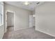 Bright bedroom featuring neutral walls, plush carpeting, and a closet at 10836 Tilston Pt, Orlando, FL 32832