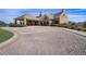 Elegant clubhouse entrance featuring a brick driveway and covered entrance at 10836 Tilston Pt, Orlando, FL 32832