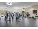 Well-equipped community gym with modern cardio and weight machines, fitness equipment, and ample natural light at 10836 Tilston Pt, Orlando, FL 32832
