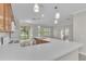 Bright kitchen showcasing the island sink, updated appliances, and sliding door access at 10836 Tilston Pt, Orlando, FL 32832